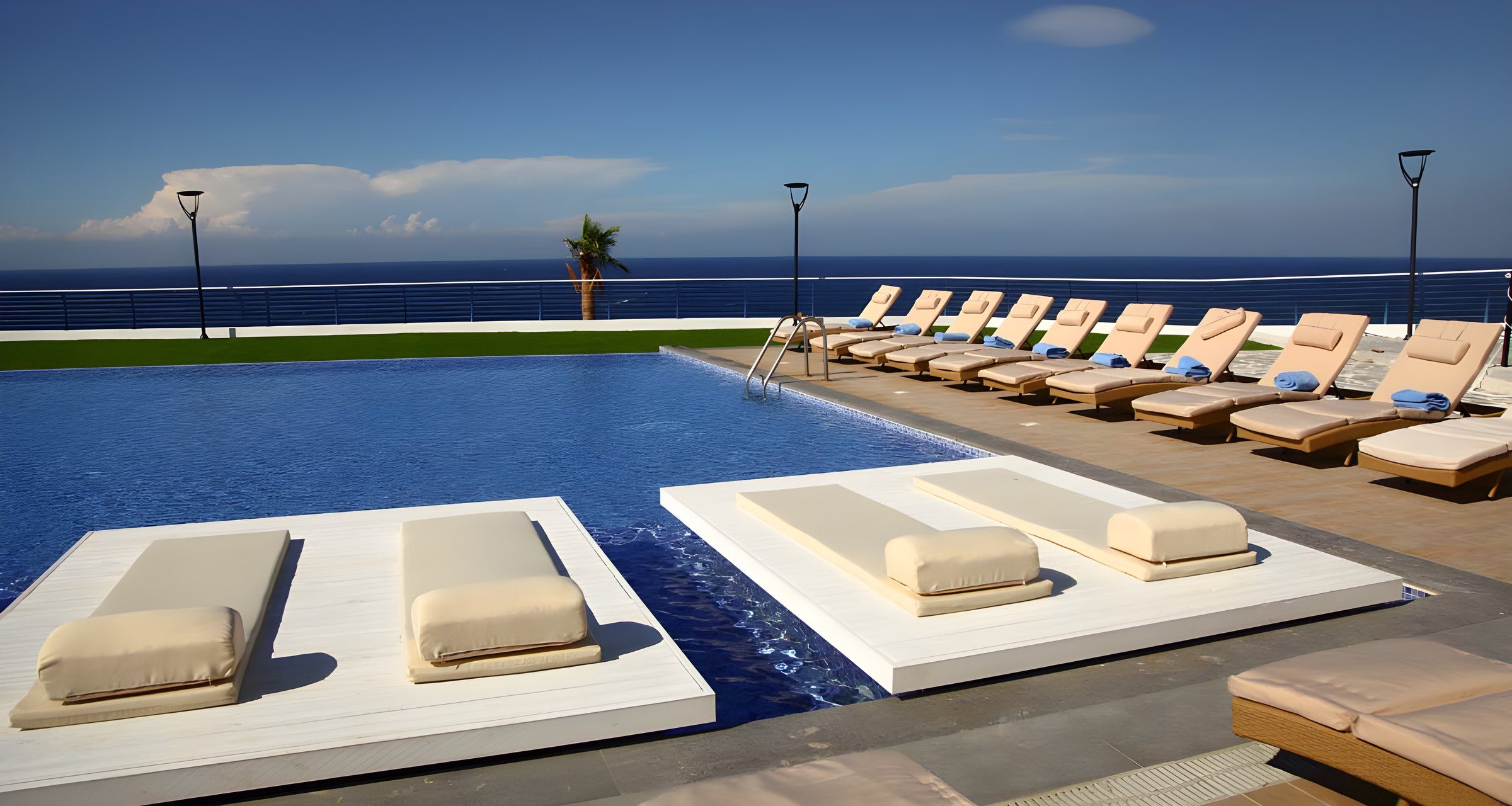 Sun beds beside the infinity pool